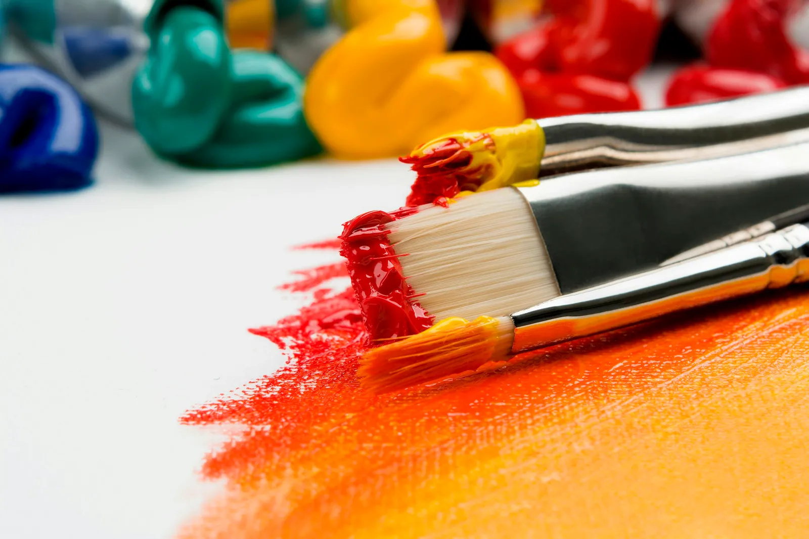 Watercolour pans and paintbrushes on a cloth